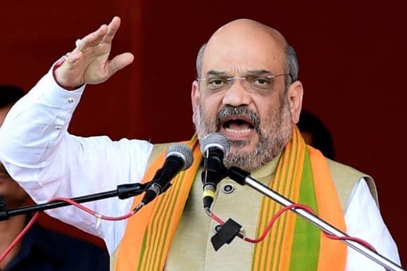 Amit Shah in Assam: “राहुल बाबा, हम बदरुद्दीन अजमल को असम की पहचान नहीं बनने देंगे” -अमित शाह